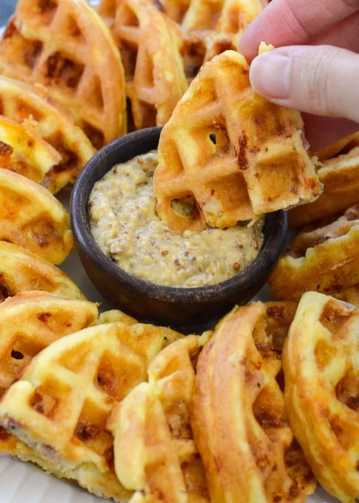 These look so good I feel like eating the picture.  I have never dipped my waffles like that, but it looks like a great idea.  I can just imagine some maple butter and a little sugar free maple syrup in a dip.  Think I am going to go over to the Maple Chaffles recipe and use that syrup on these, or maybe just some melted Cheddar cheese with bacon bits and sausage.