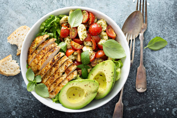 Low carb yum with avocado, boiled egg, grilled chicken breast and tomatoes and romaine.  This salad will satisfy even the most hungry person out there.