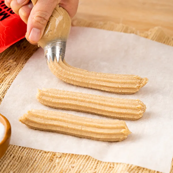 Churros being prepared to go in the air fryer
